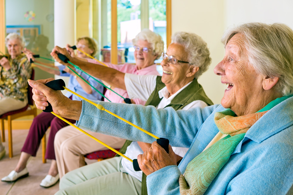 Elderly people exercising at the carehome