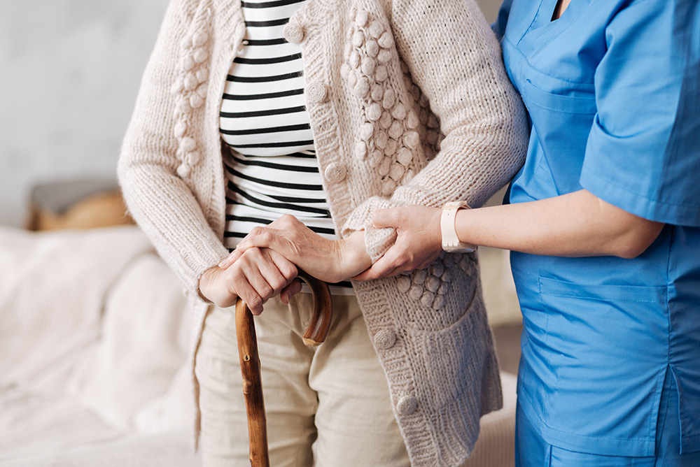 Elderly person being supported